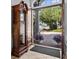 Elegant front entrance with a view to the home's driveway and landscaping, offering a welcoming first impression at 5530 Oxford Moor Blvd, Windermere, FL 34786