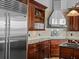 Kitchen featuring stainless steel appliances, granite countertops, and wooden cabinets at 5530 Oxford Moor Blvd, Windermere, FL 34786