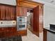 Gourmet kitchen featuring stainless steel appliances and a hidden pantry at 5530 Oxford Moor Blvd, Windermere, FL 34786