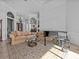 Spacious living room with elegant furnishings, piano, and architectural details at 5530 Oxford Moor Blvd, Windermere, FL 34786