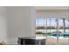 Bright living room featuring a pool view, a piano, and ample natural light at 5530 Oxford Moor Blvd, Windermere, FL 34786