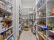 Spacious walk-in pantry with tile flooring and custom shelving perfect for organized storage at 5530 Oxford Moor Blvd, Windermere, FL 34786