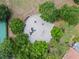 Aerial view of a community playground surrounded by trees, offering a fun, safe recreational space for children to play at 5530 Oxford Moor Blvd, Windermere, FL 34786