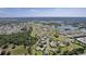 Expansive aerial view of the area showing a mix of residential and natural landscapes, plus several lakes at 5941 Sage Leaf Pl, Leesburg, FL 34748