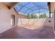 Spacious screened lanai with neutral color tones ready for your personal touches at 5941 Sage Leaf Pl, Leesburg, FL 34748