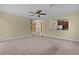 Inviting living room with an archway view into the kitchen, offering an open and airy layout at 5941 Sage Leaf Pl, Leesburg, FL 34748