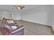 Expansive living room with luxury vinyl flooring, neutral walls, and ample space for various furniture arrangements at 597 Skyridge Rd, Clermont, FL 34711