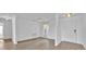 Spacious living room with luxury vinyl flooring, a modern entryway, and abundant natural light at 597 Skyridge Rd, Clermont, FL 34711