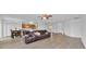Open-concept living space with luxury vinyl flooring flowing into the dining area and kitchen, perfect for entertaining at 597 Skyridge Rd, Clermont, FL 34711