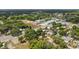 Aerial view of land for sale with mature trees and downtown access at 600 Powell St, Wildwood, FL 34785