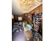 Interior shot displays a cluttered living room with damaged ceilings and walls at 600 Powell St, Wildwood, FL 34785