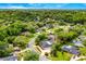 A lovely aerial shot exhibits the home's location on a tree-lined street, boasting a beautiful community at 657 Riverpark Cir, Longwood, FL 32779