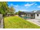 Picture perfect landscaped lawn and a large screened in pool make this back yard an outdoor paradise at 657 Riverpark Cir, Longwood, FL 32779