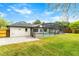 Expansive backyard showcasing a screened pool area, lush greenery, and ample space for outdoor activities at 657 Riverpark Cir, Longwood, FL 32779