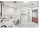 A bright bathroom featuring a dual sink vanity, freestanding tub and a modern design at 657 Riverpark Cir, Longwood, FL 32779