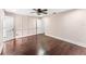 Bedroom with hardwood floors, ceiling fan and a panel accent wall at 657 Riverpark Cir, Longwood, FL 32779