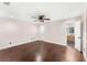 Bedroom with wood floors, ceiling fan and ensuite bathroom access at 657 Riverpark Cir, Longwood, FL 32779