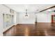 Open dining room with hardwood floors and shuttered windows allowing for ample natural light at 657 Riverpark Cir, Longwood, FL 32779