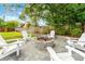 Cozy backyard fire pit area featuring a stone surround and comfortable seating, ideal for outdoor gatherings and relaxation at 657 Riverpark Cir, Longwood, FL 32779