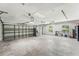 Spacious three car garage with ample room for vehicles, storage, and hobbies at 657 Riverpark Cir, Longwood, FL 32779