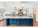 Bright kitchen featuring a large island with seating, modern appliances, and custom backsplash at 657 Riverpark Cir, Longwood, FL 32779
