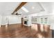 Spacious living room with fireplace, hardwood floors, recessed lighting, and access to the pool at 657 Riverpark Cir, Longwood, FL 32779