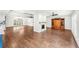 Open concept living room with hardwood floors, fireplace, recessed lighting and plantation shutters at 657 Riverpark Cir, Longwood, FL 32779