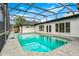 Beautiful pool area with a screened enclosure, featuring a spacious patio and view of the home's exterior at 657 Riverpark Cir, Longwood, FL 32779
