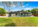 A gorgeous in-ground pool and screened in porch accentuates the lush back yard of this beautiful home at 657 Riverpark Cir, Longwood, FL 32779