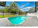 Private screened-in pool with paver deck, offering a refreshing escape with views of the landscaped backyard at 657 Riverpark Cir, Longwood, FL 32779