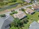 Bird's eye view of a home featuring manicured lawns and situated near a scenic pond in a community at 6608 Borg, Leesburg, FL 34748