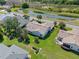 Stunning aerial view of a well-maintained home with lush landscaping and a serene water view at 6608 Borg, Leesburg, FL 34748