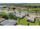 Beautiful aerial shot of a home with a well-kept lawn and lovely surroundings near a pond at 6608 Borg, Leesburg, FL 34748