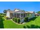 Exterior view of the house with a screened-in porch and well-manicured backyard at 6608 Borg, Leesburg, FL 34748