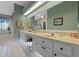 Spacious bathroom featuring a double vanity, stylish tile flooring, and ample counter space at 6608 Borg, Leesburg, FL 34748