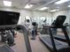 The community gym is furnished with a treadmill, elliptical, stationary bike and mirrored wall at 6608 Borg, Leesburg, FL 34748
