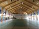 Spacious gymnasium with a wooden ceiling, badminton court, and plenty of natural light at 6608 Borg, Leesburg, FL 34748