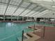 Bright indoor pool with clear water, multiple access points, and a large skylight at 6608 Borg, Leesburg, FL 34748