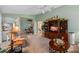 Comfortable living room featuring a ceiling fan, neutral carpet, and an open floor plan at 6608 Borg, Leesburg, FL 34748