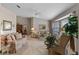 Bright living room featuring neutral walls, plush carpeting, comfortable seating, and a large bay window at 6608 Borg, Leesburg, FL 34748