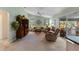 Open living room with ceiling fan, neutral carpet, and slider door to the outdoor space at 6608 Borg, Leesburg, FL 34748