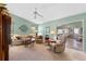 Spacious living room with large windows, plush seating, and sliding glass doors at 6608 Borg, Leesburg, FL 34748