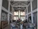 Grand lobby featuring soaring ceilings, modern light fixtures, and stylish seating arrangements at 6608 Borg, Leesburg, FL 34748