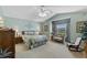 Vaulted main bedroom with sitting area, ensuite bathroom, and walk in closet at 6608 Borg, Leesburg, FL 34748