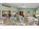 Bright sun room featuring white wicker furniture and views to the outside at 6608 Borg, Leesburg, FL 34748