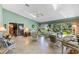 Bright sun room with glass table, tile floors, and sliding glass doors to the outside at 6608 Borg, Leesburg, FL 34748
