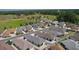An aerial view displays an overview of the community and neighborhood at 7382 Se 167Th Zina Ln, The Villages, FL 32162