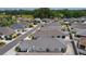 An aerial view captures the home's backyard, landscaping, and the surrounding neighborhood at 7382 Se 167Th Zina Ln, The Villages, FL 32162