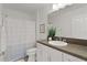 Bathroom with a large mirror, updated fixtures, and shower with tub combination at 7382 Se 167Th Zina Ln, The Villages, FL 32162