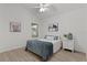 Comfortable bedroom with shuttered window, wood floors, and simple decor at 7382 Se 167Th Zina Ln, The Villages, FL 32162